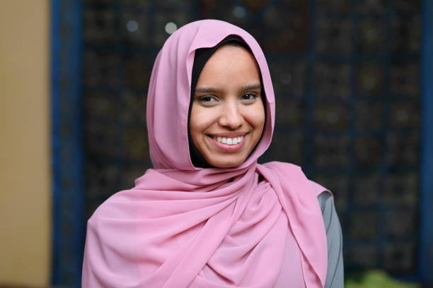 istock Middle Eastern Woman Pink Hijab 1319291656