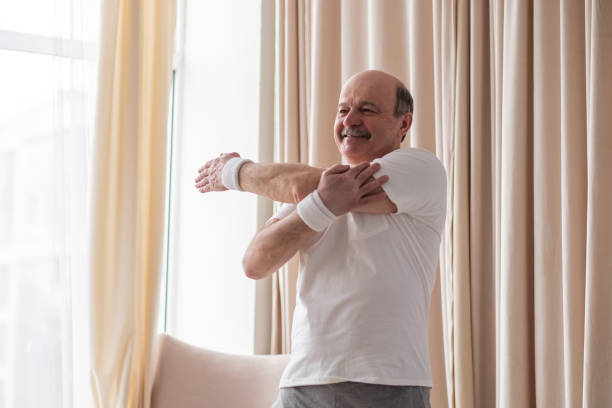 istock Senior hispanic man warming up at home 1319291702