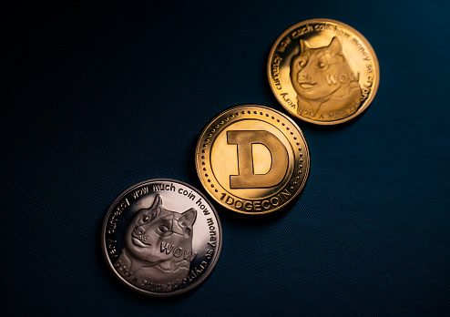 Antalya, Turkey - May 21, 2021: Dogecoin is a cryptocurrency, like Bitcoin or Ethereum. Dogecoin was created by Billy Marcus and Jackson Palmer in late 2013.