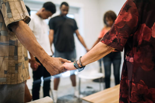 istock Extended Family Reuniting Together For Prayer 1319293510