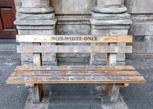 Non-White only - a bench in Cape town. Bench with an inscription as a memory of apartheid and segregation in South Africa.