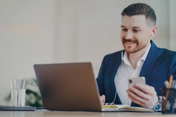 istock Happy businessman having video conference call while working at office 1319296741