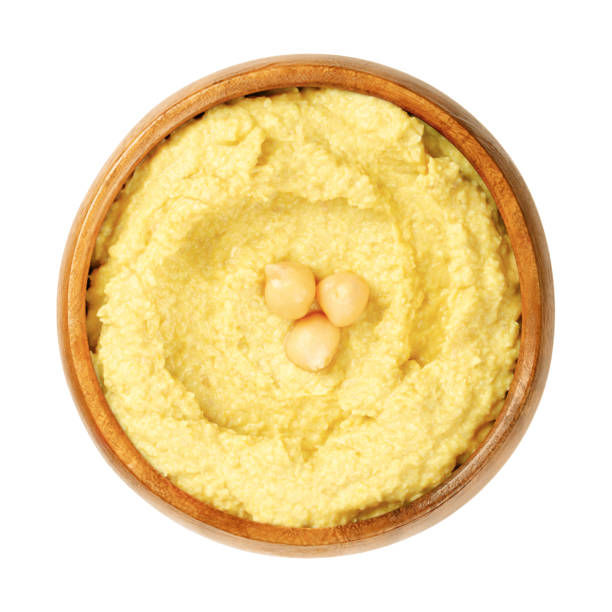 istock Curry hummus dip with chickpea garnish, in a wooden bowl 1319297949