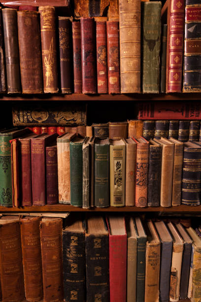 Bookshelf Full of Antique Hardcover Books Bookshelf full of antique hardcover books. old book stock pictures, royalty-free photos & images