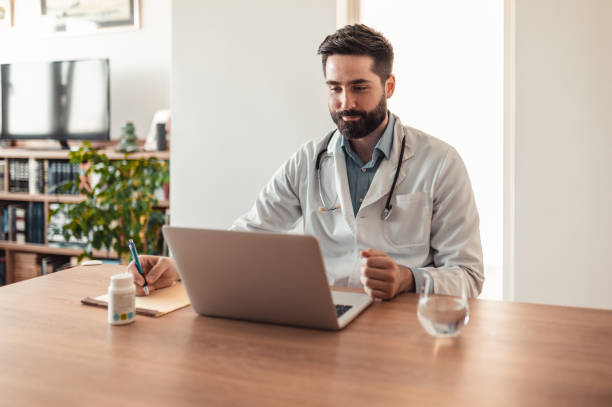 istock Doctor talking with his patient via video call 1319298967
