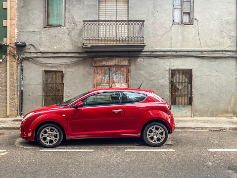 Valencia, Spain - May 9, 2021: Red Alfa Romeo car model MiTo parked in the street. The Italian manufacturer produced it from 2008 to 2018
