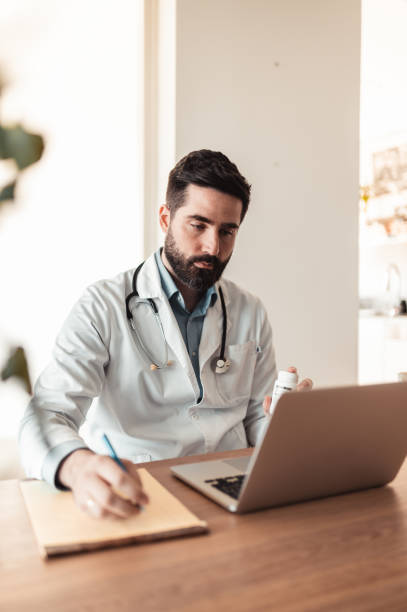 istock Doctor on a video call with his patient 1319299375