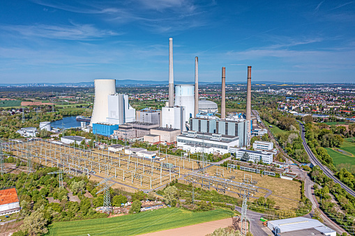 Aerial view of coal fired power plant during daytime with sunshine and clear sky
