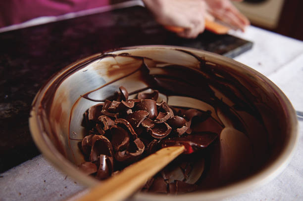istock Metal bowl with dark chocolate and cooled melted chocolate mass 1319305807