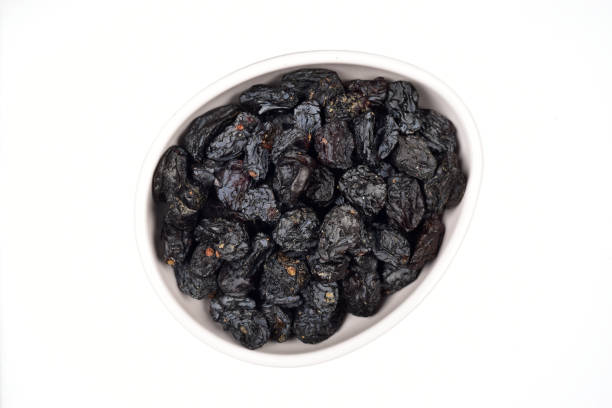 istock Dry Blackberry In Bowl Isolated On White Background 1319308770