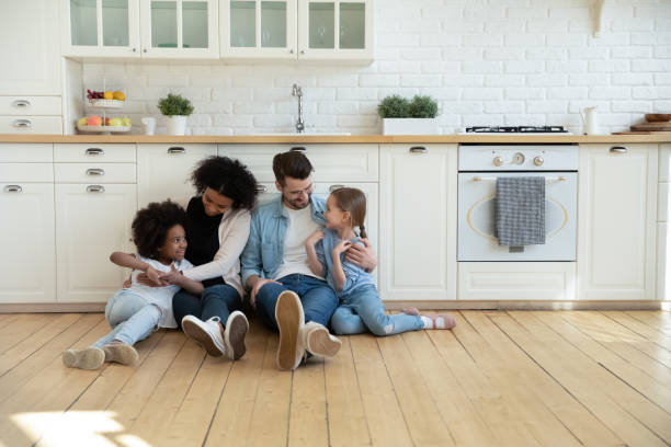 Happy multiracial family with kids relax at home