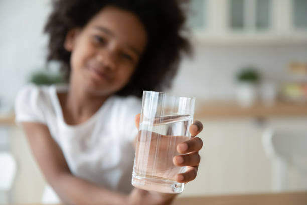 istock Close up of biracial child recommend water drinking 1319314706