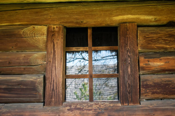 istock Title: Wooden wall with window. Rustic style. Ecological housing. 1319317516