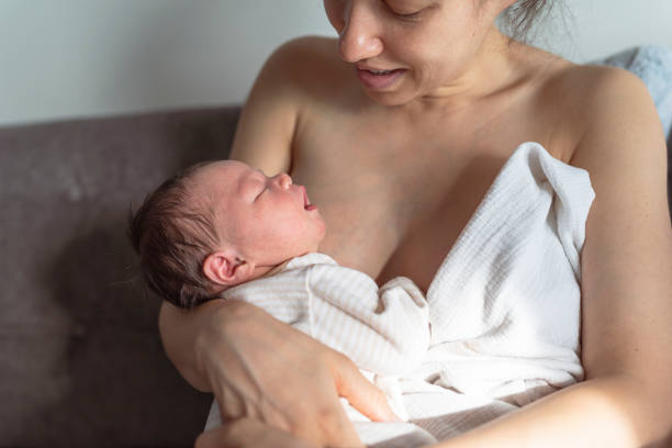 istock Ethnic Mother Smiling At Her Baby 1319318576
