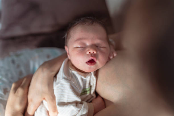 istock Sleeping Baby Resting On Mother After Breastfeeding 1319318580