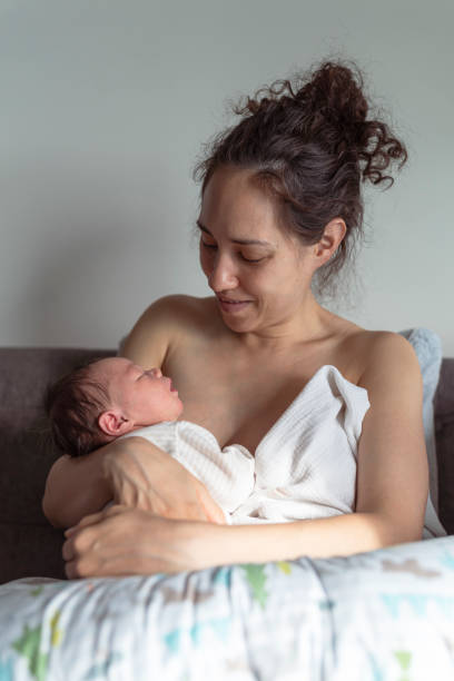 istock Ethnic Mother Snuggling Baby 1319318581
