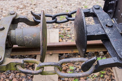 Three-link locomotive chain coupler (rolling stock connection) close up detail. The basic type of coupling on railways (buffer and chain)