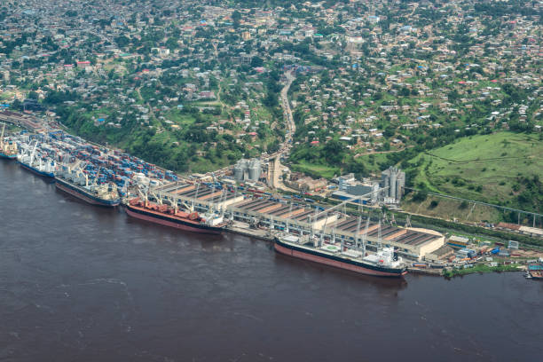 Matadi, the main sea port of Congo, DRC The sea port of Matadi at the Congo River. Matadi is the chief sea port of the Democratic Republic of the Congo, it is the last navigable point before rapids make the river impassable for a long stretch upriver. Matadi is also the capital of the Kongo Central province, it was founded in 1879 by Sir Henry Morton Stanley. democratic republic of the congo stock pictures, royalty-free photos & images