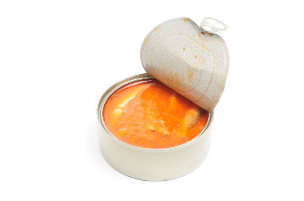 istock Tinned fish in tomato sauce on a white plate 1319332208