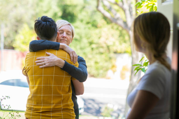 istock Millennial Sisters Greeting their Mother 1319334484