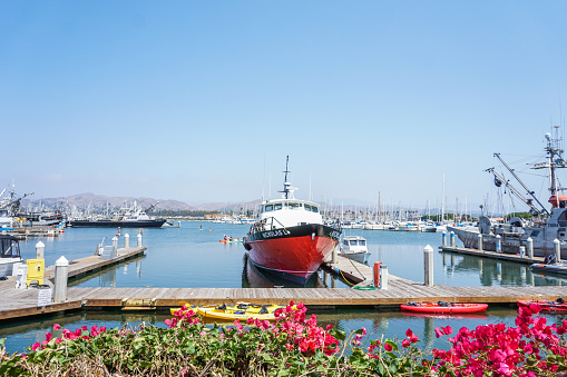 August 12, 2017 Ventura, California.  The Ventura Harbor is a popular destination in Southern California. Tourists enjoy the unique shops, restaurants, and scenic views. Summertime in Ventura is a pleasant experience for all. Large vessels can be observed in the slips of the harbor.