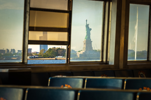 The Statue of Liberty shot from inside the Staten Island Ferry.