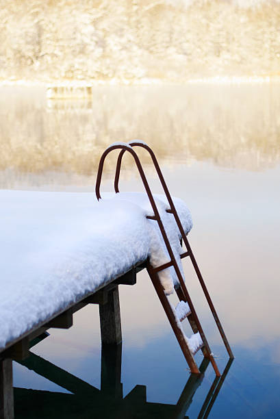 Jetty with scale under snow stock photo