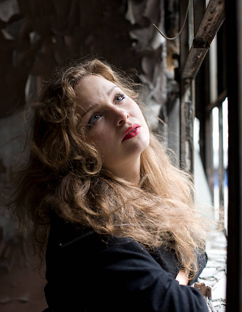 istock beautiful woman in ruined building 131935009
