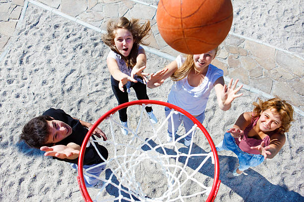 istock Teenagers throwing ball 131935055