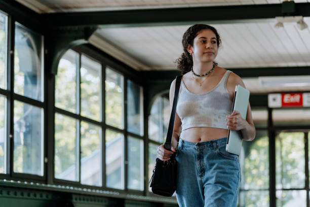 istock Young woman going to work by train 1319357968