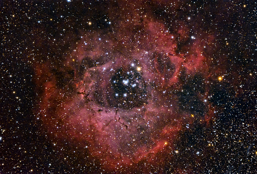 The Rosette Nebula  is an H II region located near one end of a giant molecular cloud in the Monoceros region of the Milky Way Galaxy.