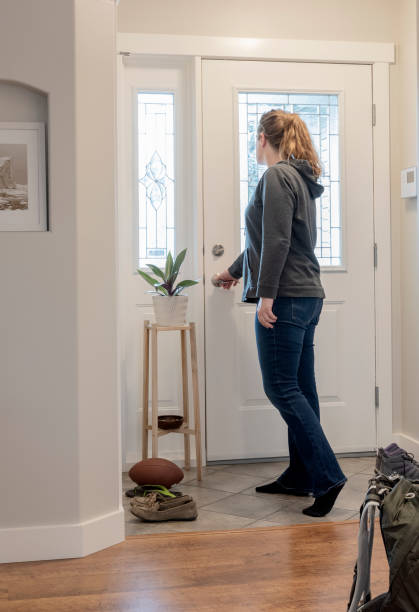istock Answering the Door, Sun lit Entry 1319367655