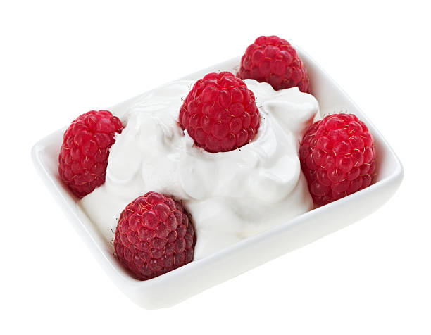 istock Red ripe raspberry fruit in small square plate with cream 131937419