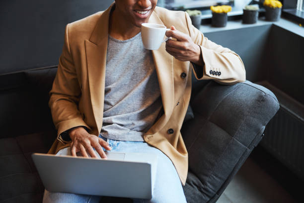 istock Close up of kind freelancer enjoying aroma coffee 1319376269