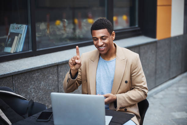 istock Close up of joyful freelancer having online conference 1319376311