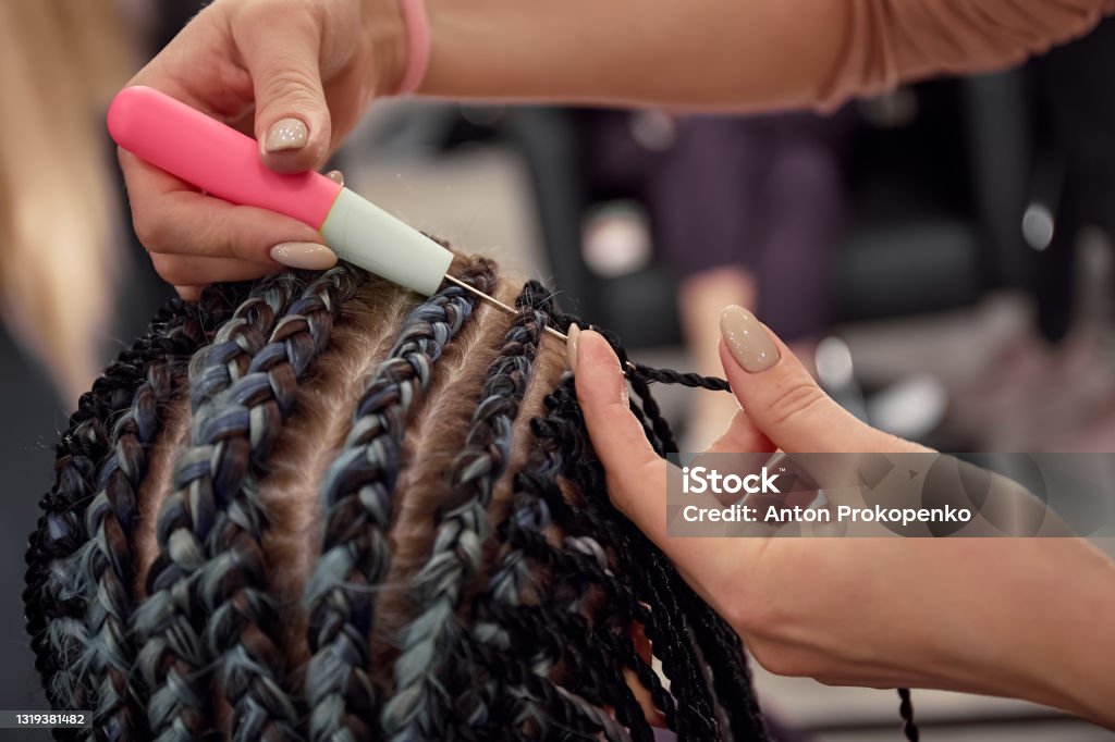 Beauty salon master works, Afro-braids and dreadlocks Braided Hair Stock Photo
