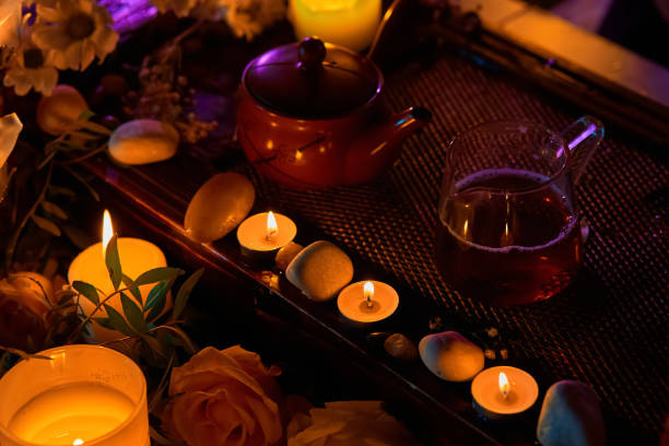Tea ceremony, candles roses and stones, spa relaxation stock photo