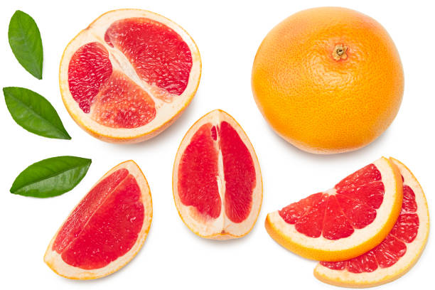 istock grapefruit with slices and green leaves isolated on white background top view. clipping path 1319384013
