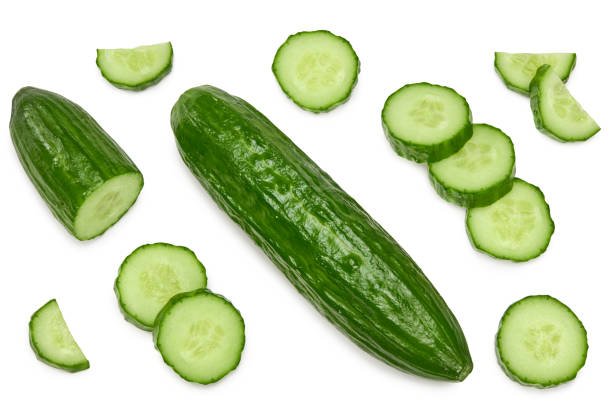 istock cucumber with slices isolated on white background. clipping path. top view 1319384019