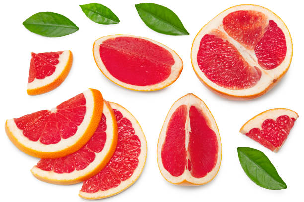 istock grapefruit with slices and green leaves isolated on white background top view. clipping path 1319384073