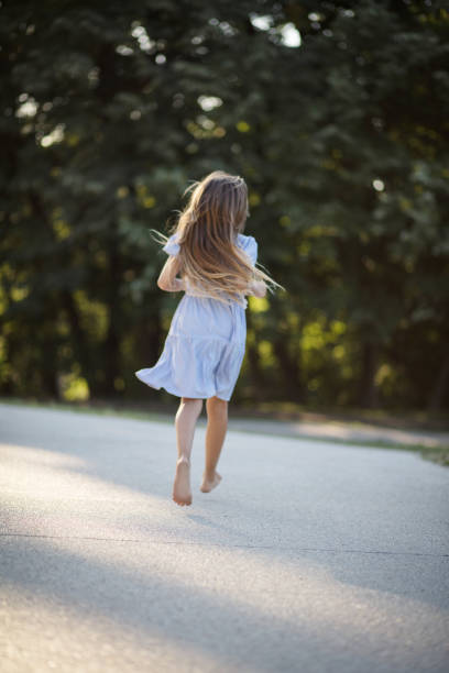 istock Little girl spending time in nature. 1319385515