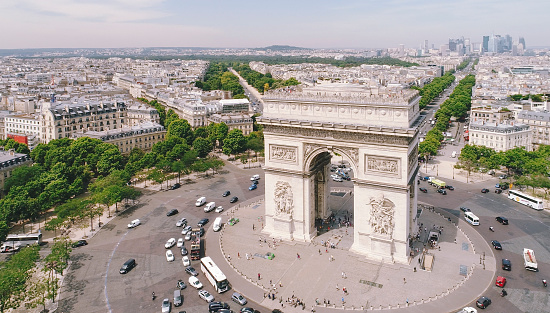 Immerse yourself in the heart of Paris with this breathtaking drone view of the Arc de Triomphe and radiating avenues.