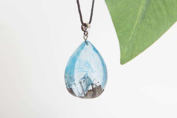 istock Real flowers in epoxy resin, jewelry 1319389611