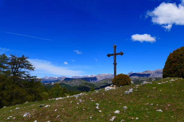 istock Cross next to the Saint Jean Baptiste chapel, Beuil les Launes 1319389721