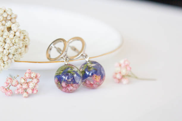 istock Real flowers in epoxy resin, jewelry 1319389924