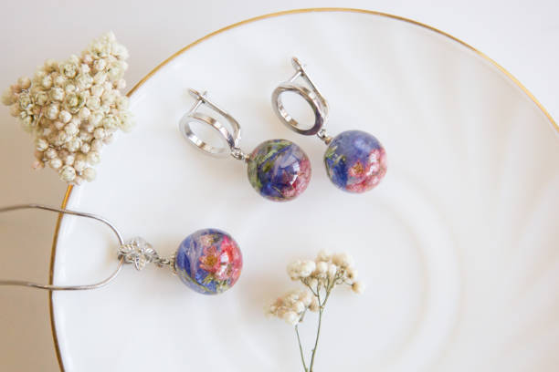 istock Real flowers in epoxy resin, jewelry 1319390464