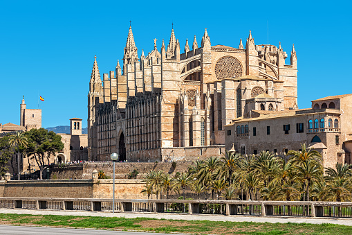 Famous Cathedral of Santa Maria (aka La Seu) under blues sky in Palma de Mallorca, Spain.