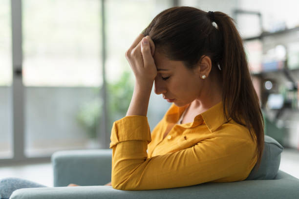 istock Depressed lonely woman sitting at home 1319393697