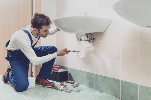 istock Plumber fixing a sink at home 1319394651