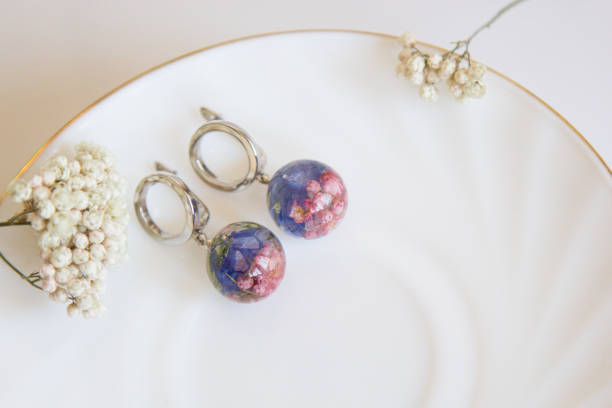 istock Real flowers in epoxy resin, jewelry 1319395423